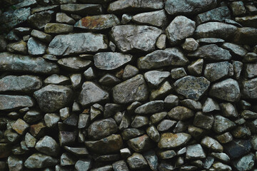 Many different size of black stone wall for abstract background and texture for interior or exterior design. Beautiful patterns, space for work, banner, wallpaper close up.