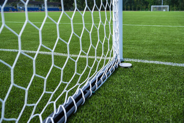 Soccer Goal Net at a Well-Maintained Turf Field in Bright Daylight