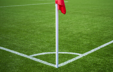 Fototapeta premium Corner Flag On A Green Soccer Field During Daytime