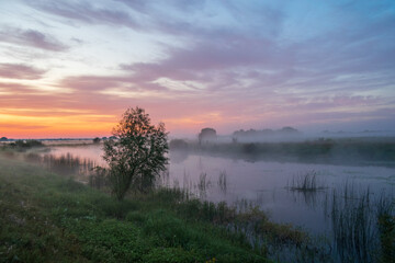 Obraz premium amazing sunrise over the river