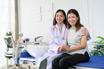 Obraz premium Female Doctor and Patient Smiling Together in a Hospital Room, Showing Compassionate Healthcare and Support