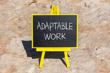 Adaptable work symbol. Concept words Adaptable work on beautiful yellow blackboard. Beautiful red stone beach background. Business Adaptable work concept. Copy space.