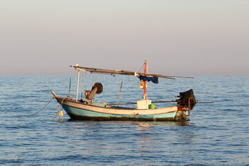 A small fishing boat floating in the sea