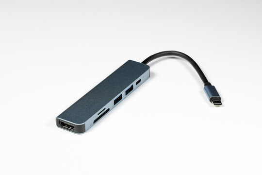 modern multifunctional adaptor or multiport docking station provide multi type of input output port for computer user - isolate on white background.
