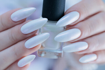 beautiful female hands with long nails light white manicure