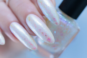 beautiful female hands with long nails light white manicure