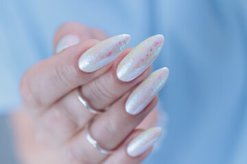 beautiful female hands with long nails light white manicure