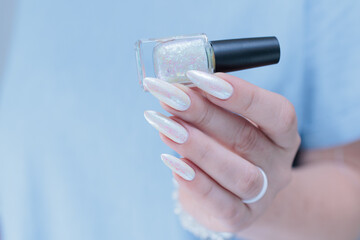 beautiful female hands with long nails light white manicure