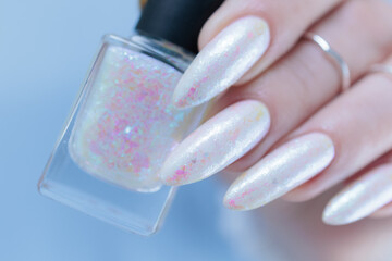beautiful female hands with long nails light white manicure