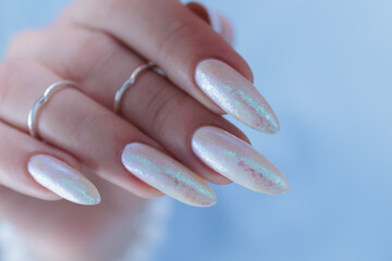 beautiful female hands with long nails light white manicure