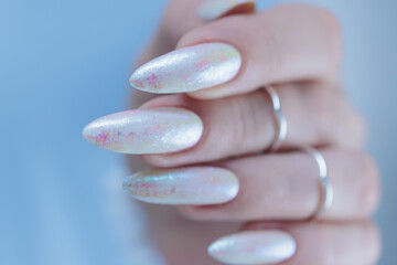 beautiful female hands with long nails light white manicure
