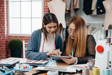 multi-ethnic designer group Discusses and exchange ideas for clothing design with intention and happiness.