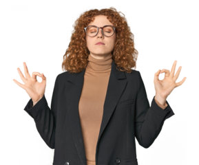 Young Caucasian redhead in business attire relaxes after hard working day, she is performing yoga.