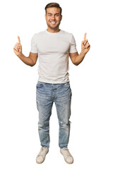 Full body portrait of a man in studio indicates with both fore fingers up showing a blank space.