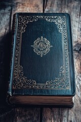 Fototapeta premium A black book sitting on a wooden table