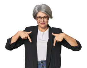 Caucasian mid-age female in business suit points down with fingers, positive feeling.