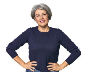 Caucasian mid-age female on studio background confident keeping hands on hips.