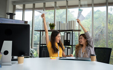Asian smart Office or businesswoman excited successful business people, celebrating win. Two...