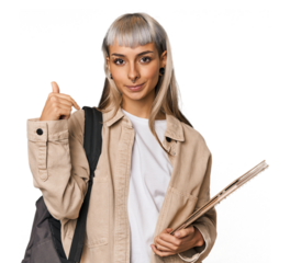 Caucasian young student with books person pointing by hand to a shirt copy space, proud and confident