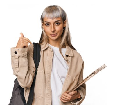 Caucasian young student with books person pointing by hand to a shirt copy space, proud and confident