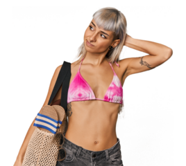 Young caucasian woman in a bikini touching back of head, thinking and making a choice.