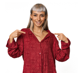Young caucasian young woman in studio surprised pointing with finger, smiling broadly.