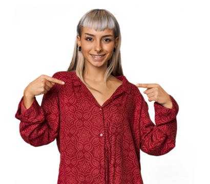 Young caucasian young woman in studio surprised pointing with finger, smiling broadly.