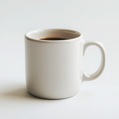 A simple white coffee mug filled with dark beverage on a clean background, perfect for mornings or office settings.