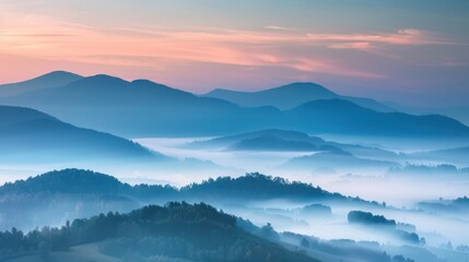 Misty mountain landscape at sunrise.