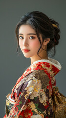 A woman wearing a kimono with a floral pattern