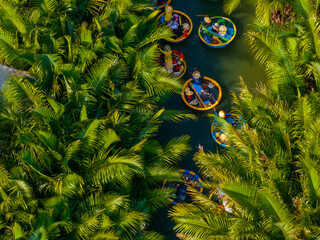 Aerial view of a coconut village basket boat tour. Palms forest in Hoi An ancient town, Cam Thanh,...