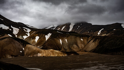 Fototapeta premium Majestic Mountains of Landmannalaugar. Icelandic colorful mountains in snow.