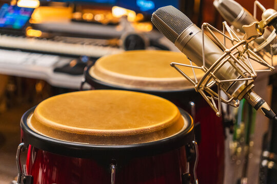conga drums in recording studio with microphones