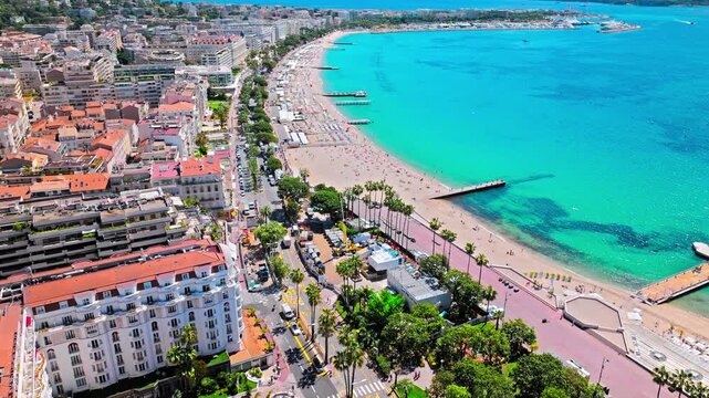 Aerial view of Cannes famous resort town on the coastal French Riviera. Luxury travel destination in France, town with sandy beaches Croisette Beach Cannes and palatial hotels.
