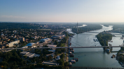 Panoramic view of Belgrade Fair and Ada Bridge spanning the Sava River at sunset
