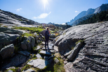 Young hiker woman in Vall de Boi, Aiguestortes and Sant Maurici National Park, Spain