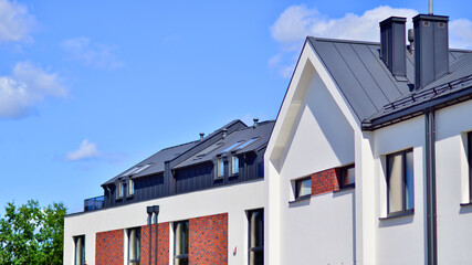 Terraced single family homes in newly developed housing estate. The real estate market in the suburbs. 