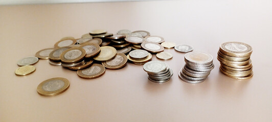 Stacks of Turkish money, broken metal Turkish Lira on a white background.