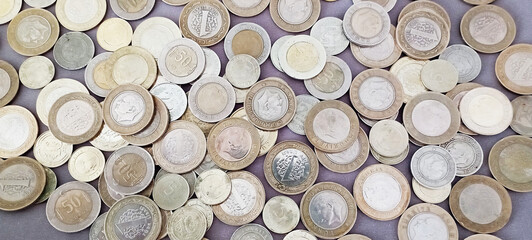 Stacks of Turkish money, broken metal Turkish Lira on a white background.