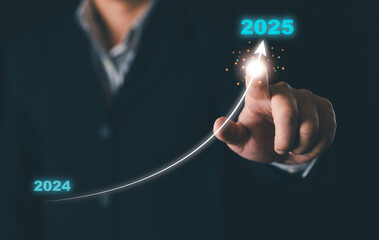 Businessman hand drawing arrow line with increasing direction from year 2024 to 2025 for...
