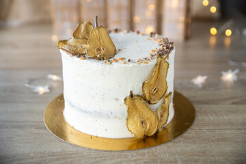 Spiced Pear Cake with vanilla cream, golden pear slices, star sprinkles
