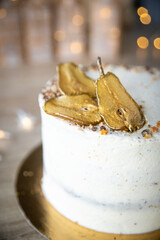 Spiced Pear Cake with vanilla cream, golden pear slices, star sprinkles