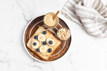 peanut butter banana toast topped with berries, American breakfast