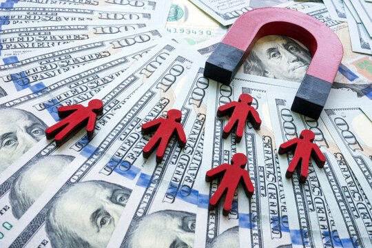 Cash and a magnet that attracts customers or clients.