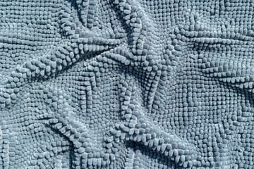 A close-up view of knitted terry cloth with folds