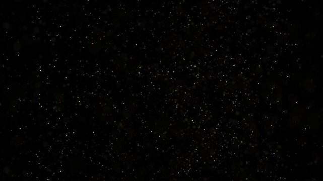 dust particals flying against black background 4k