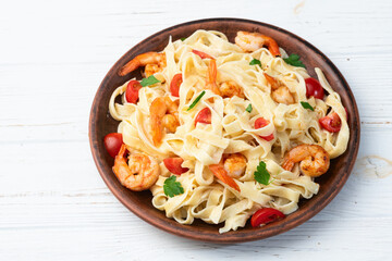 Italian pasta with shrimps , parmesan and tomatoes