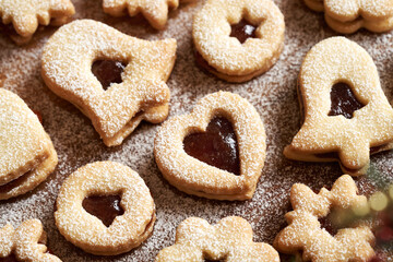 Linzer Christmas cookies filled with jam and dusted with sugar