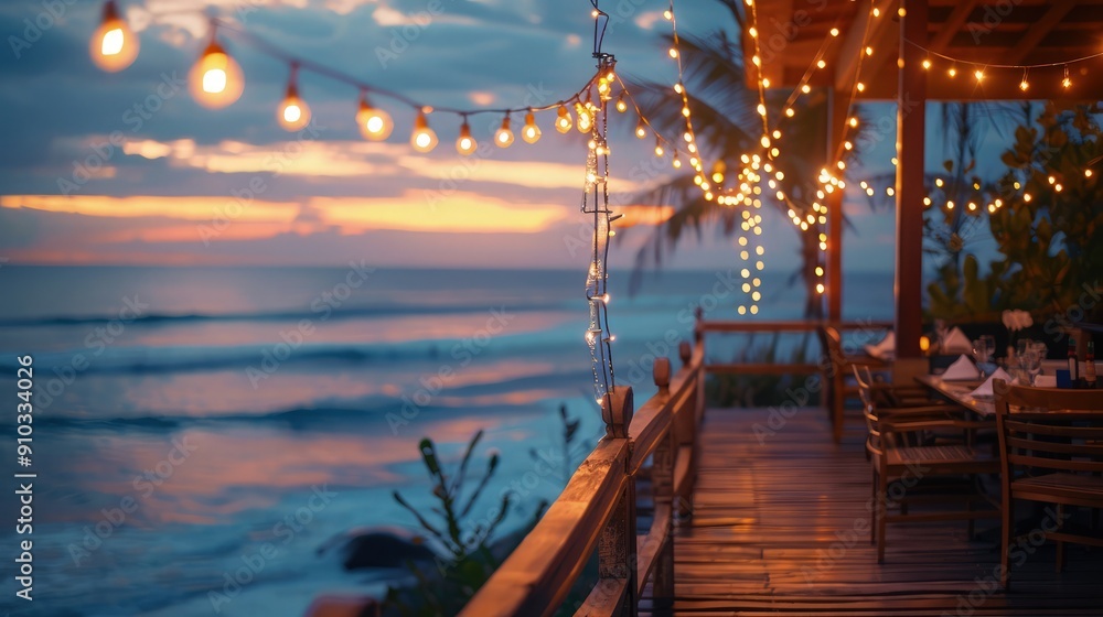 Poster dreamy string lights draped across the terrace of a beachfront cafe, with soft light reflecting off 