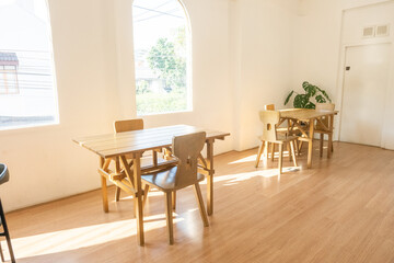 Modern interior of stylish dining room interior with family table and wood chairs,Neutral living room,stylish home decor,Template.